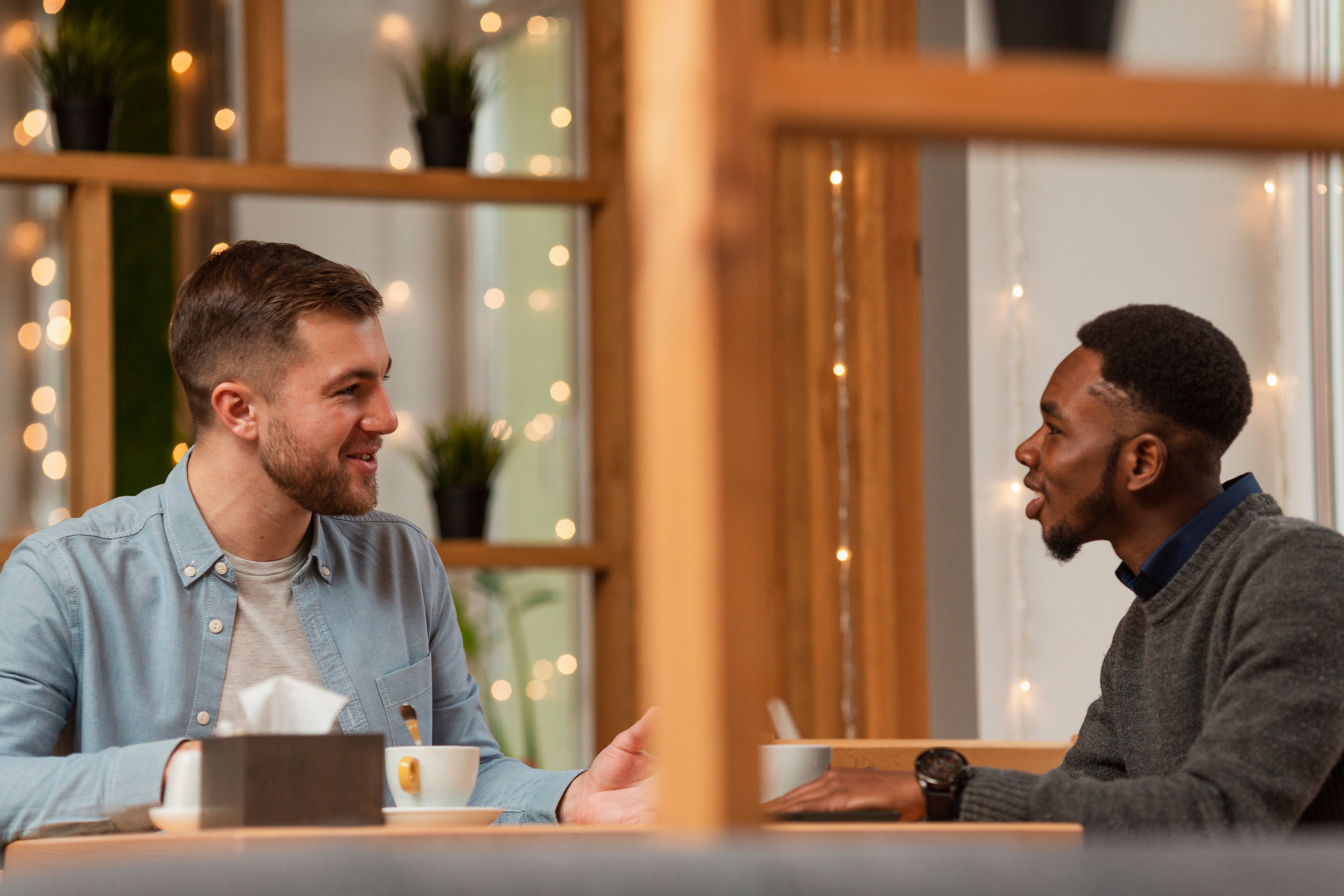 male-friends-meeting-restaurant